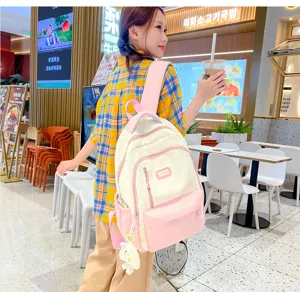 Pink white college student backpack detail view, large capacity casual daily school bag.
