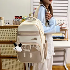 Cute Japanese style backpack for students, casual daily laptop daypack with plush pendant.