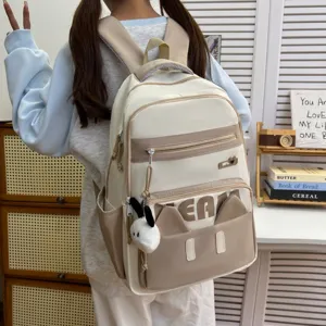Casual cute student backpack with cat ears and plush pendant, light and trendy daily bag.