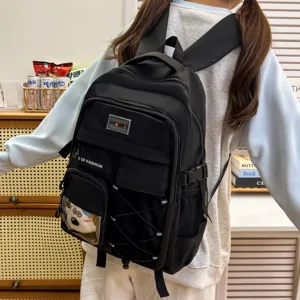 Detailed view of large capacity black student backpack, casual school bag for teenagers daily use.