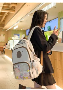 Cute transparent backpack for school girls, large capacity aesthetic daypack with front pocket.