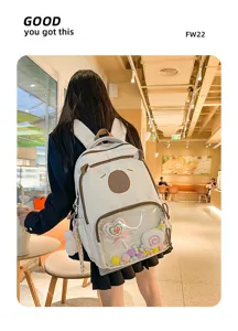 Clear backpack detail showing cute bear face and transparent front pocket with plush toys.