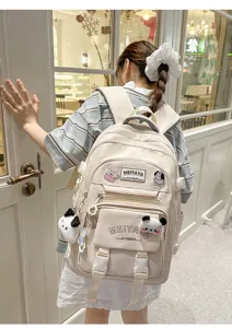 Large capacity casual canvas backpack for students with cute plush toy pendant details.