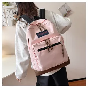Casual canvas pink backpack with contrast bottom and multiple pockets for daily school use