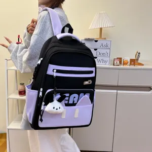 Detailed view of the cute black and purple backpack with rabbit pendant and pockets.