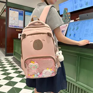 Cute pink canvas backpack for teen girls, large capacity school bookbag with clear front pocket.