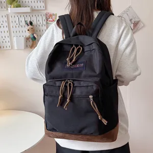 Casual black backpack for school travel and daily use with spacious compartments and stylish design.