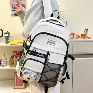 Detail view of white student backpack with mesh pockets, transparent pouch and compartments.