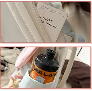 Close-up detail of the canvas backpack showing zipper pocket and side water bottle storage.