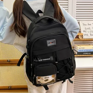 Large capacity black school backpack for students, stylish casual daypack with multiple pockets.