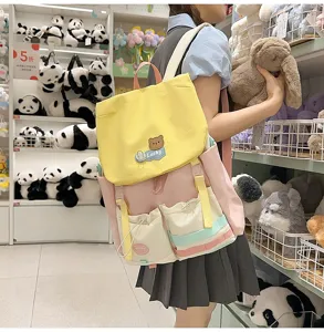 Dopamine color-blocked school backpack with cute bear badge, large capacity casual daily bag.