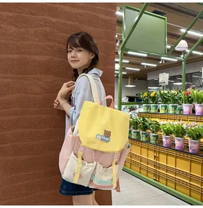 Colorful dopamine canvas backpack for students, large capacity casual daypack with cute bear patch.