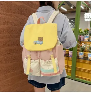 Dopamine color-blocked canvas backpack for student casual daily use with large capacity.