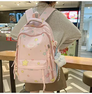 Cute pink star print school backpack detail, lightweight large capacity casual daypack for teens.