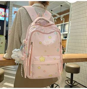 Pink canvas school backpack with star pattern and cute plush pendant for daily travel