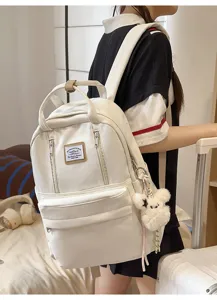 Casual white school backpack for women, large capacity daily travel daypack with cute plush charm.