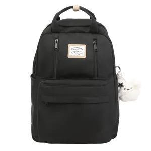 Black casual school backpack for women with front pockets and cute plush pendant charm.