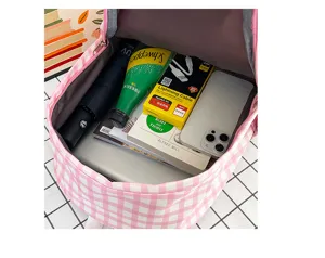 Detailed view of the pink and white plaid backpack interior showing large capacity for daily items.
