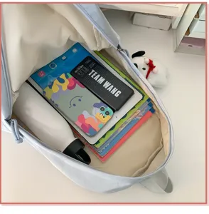 Interior detail view of the light blue casual school backpack showing spacious storage capacity.