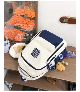 Japanese color-block casual backpack, stylish large-capacity school bag for students and daily travel.