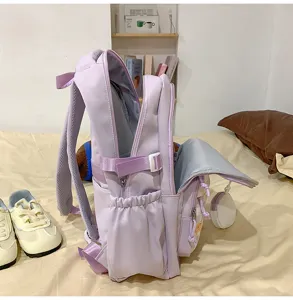 Detailed view of the light purple casual backpack showing multiple compartments and side pockets.