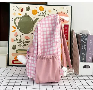 Pink plaid school backpack, cute student rucksack with side pockets and plush decor.