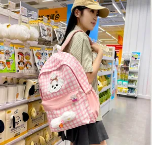 Pink plaid school backpack for women, cute dog patch casual daypack for student daily use.