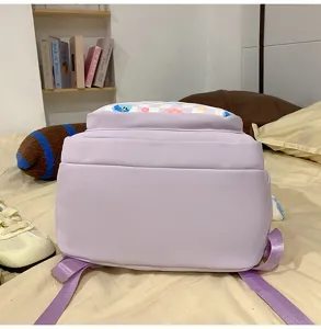 Detail view of the Japanese casual large-capacity school backpack in soft purple with cute pattern.