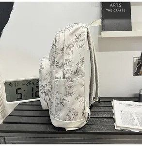 Lightweight student backpack with bamboo print, side pocket design, casual travel daypack.