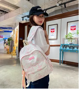 Stylish pink tie-dye backpack for women, large capacity casual school bag for daily use.