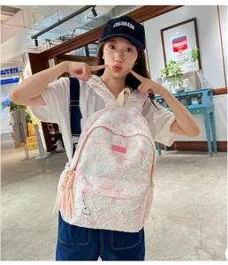 Casual pink textured women backpack, large capacity school bag for students and daily use.
