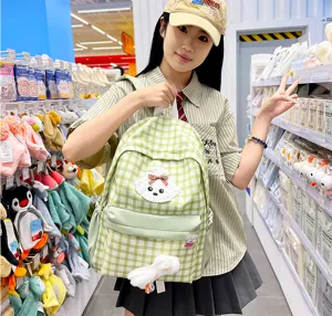 Japanese style green plaid backpack with cute dog patch and plush pendant for student girls.