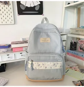 Korean ins style light blue canvas backpack with floral patch, great for school daily commute.
