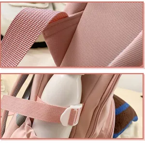 Pink school backpack detail view featuring durable fabric straps and convenient side bottle holder.