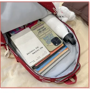 Spacious large capacity student school backpack in red, perfect for daily books and essentials.