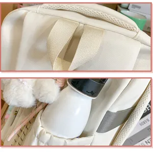 Primer plano de los detalles de la mochila blanca con asa resistente y bolsillo.
