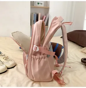 Pink backpack detail view, large capacity casual school bag for daily travel and students.