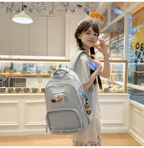 Cute light blue school backpack for teen girls, large capacity travel daypack with animal prints.