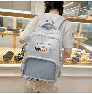 Cute light blue school backpack for teen girls, large capacity casual daypack with mesh pocket.