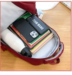 Detailed view of large capacity red school backpack interior showing spacious storage space.