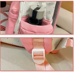 Backpack detail view showing side pocket and adjustable shoulder strap, nylon material.
