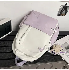 Casual two-tone canvas backpack for women, stylish minimalist school bookbag for daily travel.