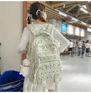 Light green casual backpack for women, stylish travel schoolbag with large capacity.