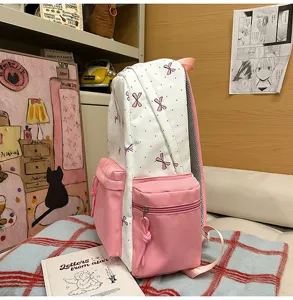 Cute Japanese style nylon backpack with bow and polka dot pattern, large capacity for students.