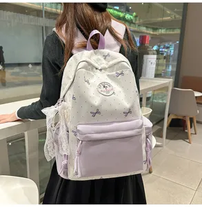 Japanese style student backpack large capacity nylon school bag for women daily casual use.
