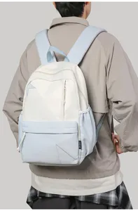 Stylish casual colorblock backpack with star patch details and convenient front zipper pocket.