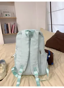 Cute bow embroidered backpack casual school bag for teenage girls daily travel use.