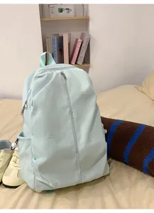 Mint green school backpack featuring cute embroidered bows, perfect for daily casual and school use.