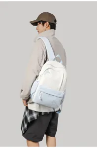 Detail view of the contrast color school backpack with star accent and comfortable wide straps.