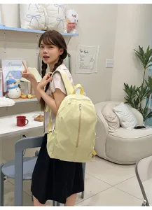 Cute bow embroidered backpack for girls, casual versatile school bag and travel daypack.